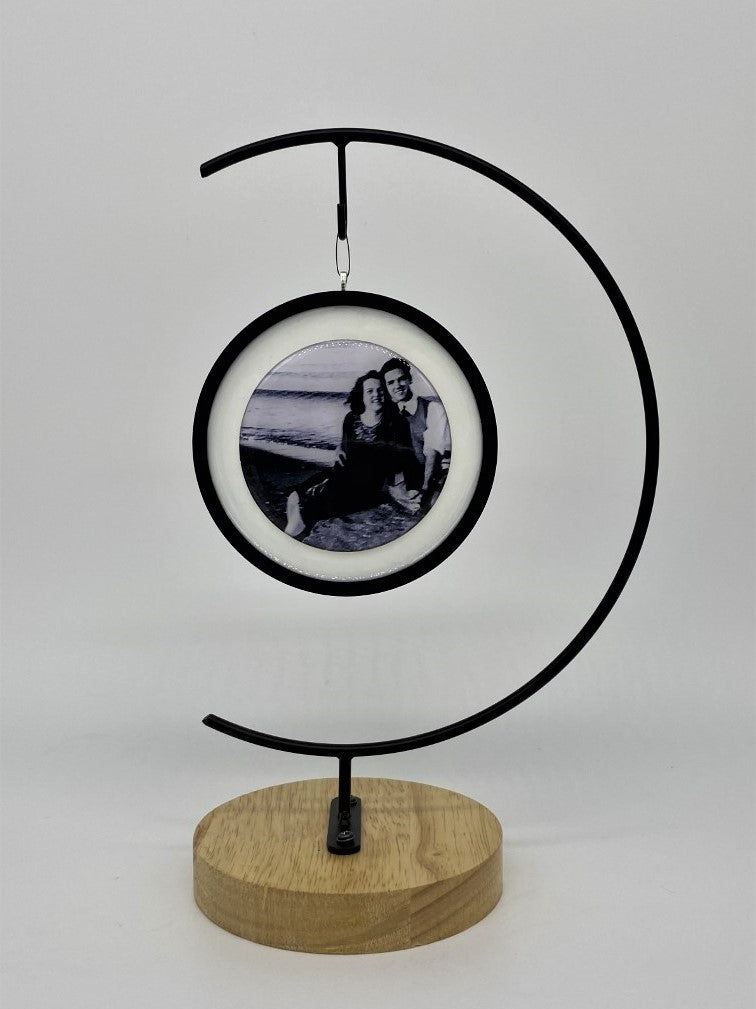 A black and white photo hanging from frame