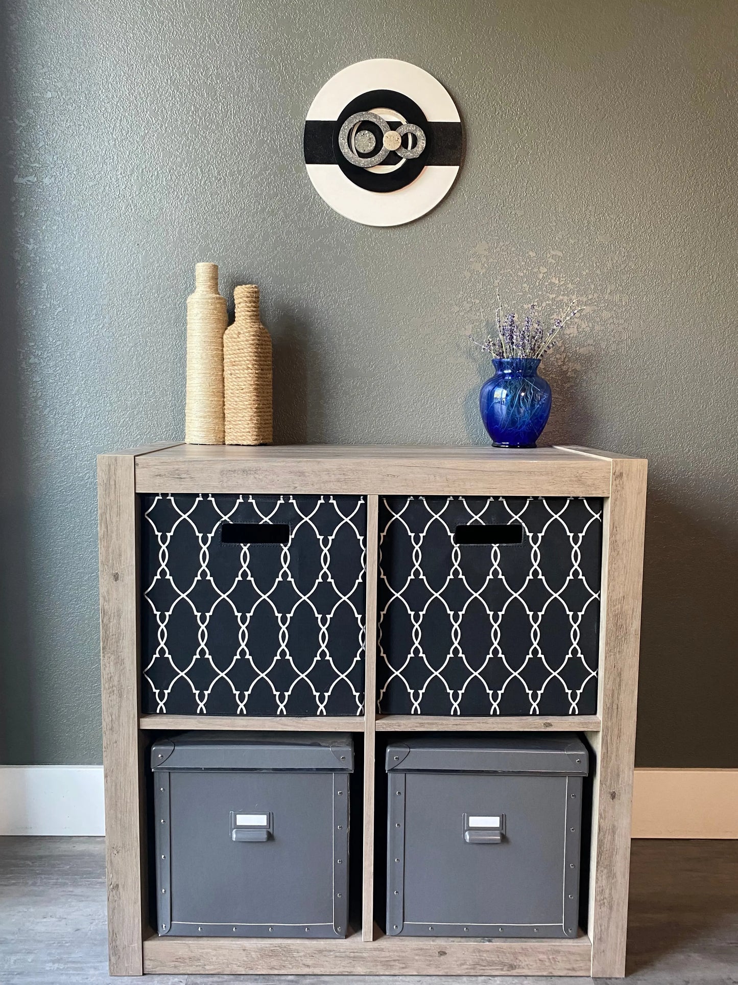 Front view of memorial wall art showing layered resin circles, textured black stripe, and handcrafted white frame