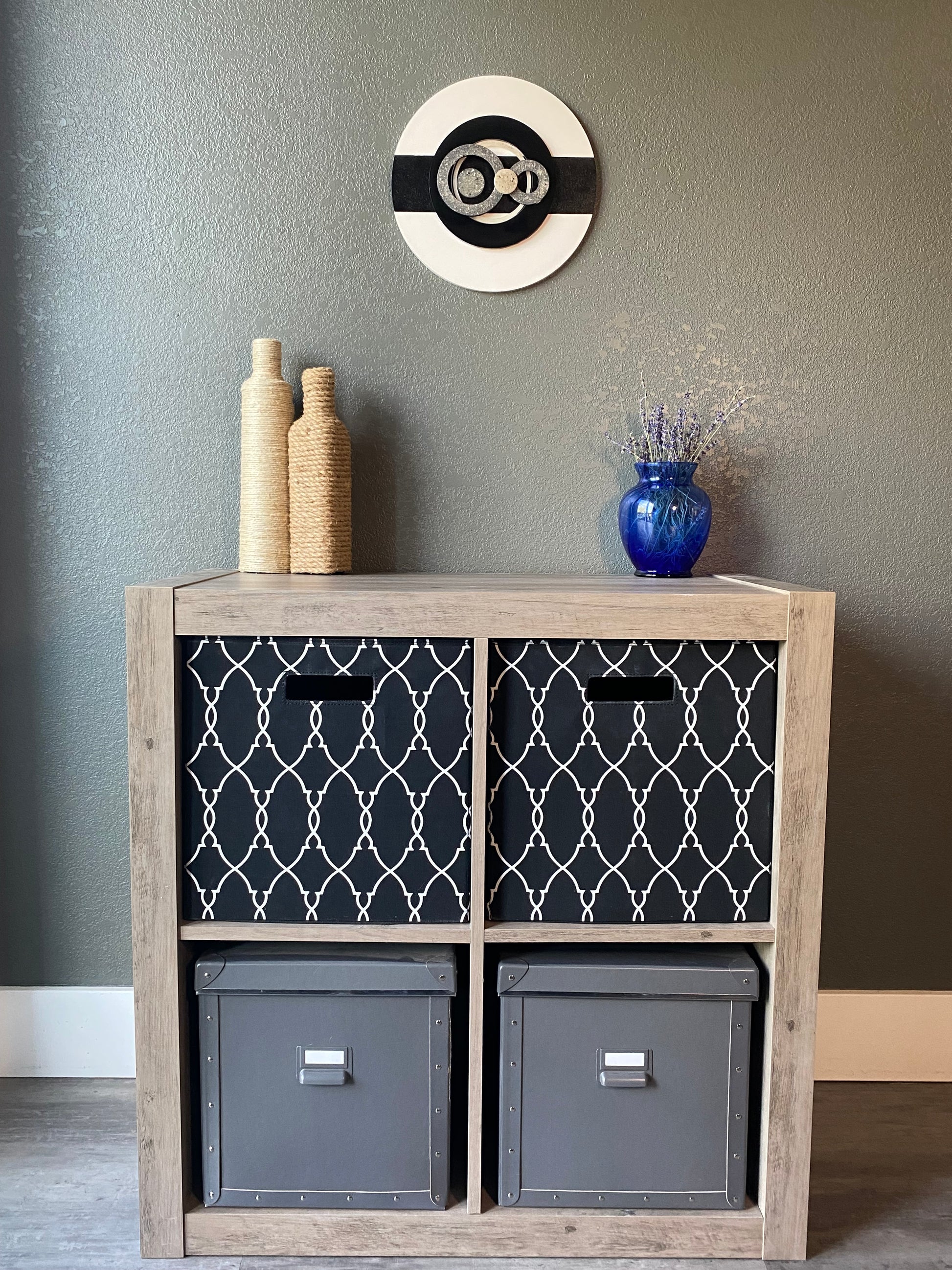 Front view of memorial wall art showing layered resin circles, textured black stripe, and handcrafted white frame