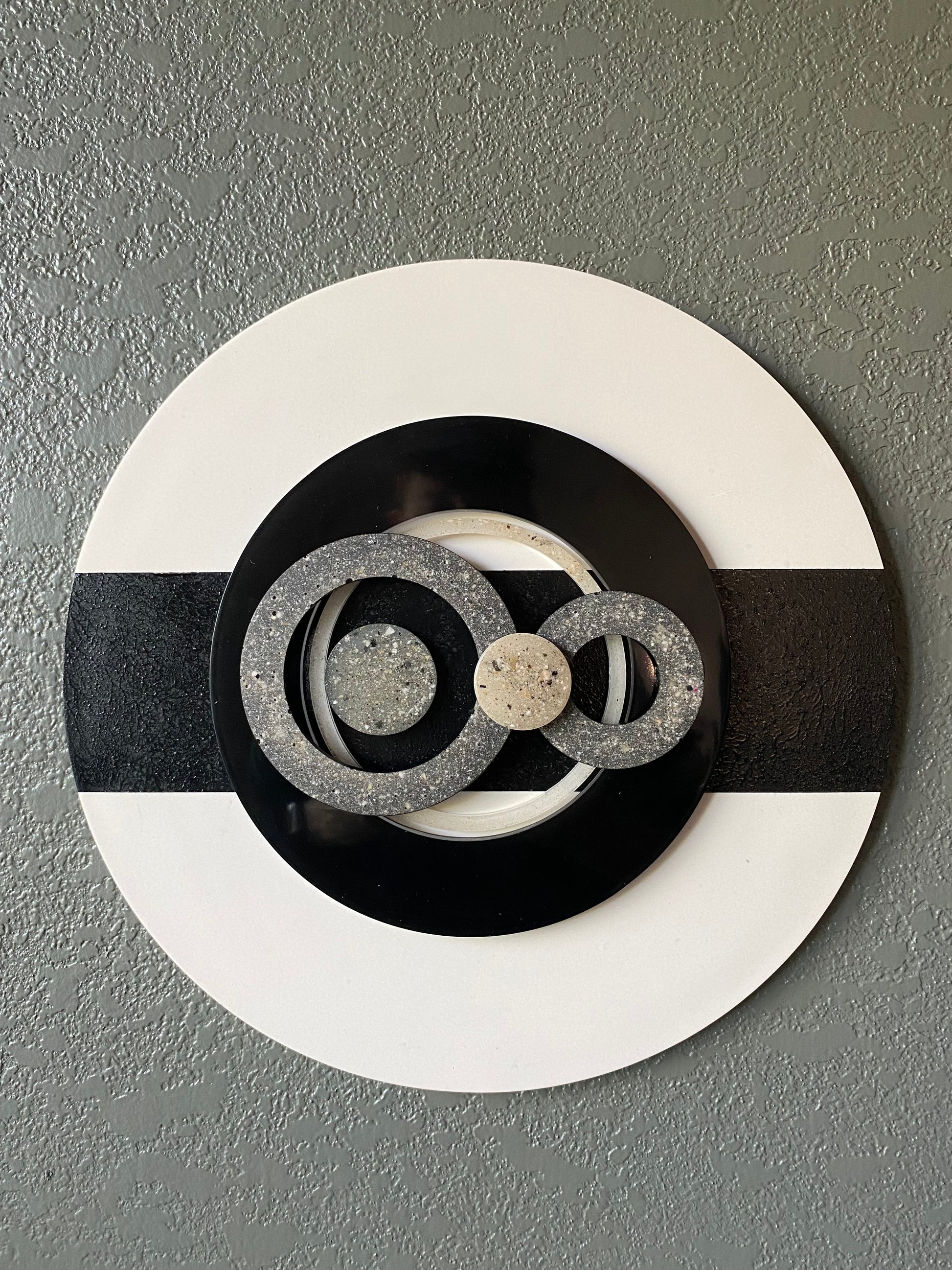 Infinity cremation ash memorial wall art with resin circles on white frame and black textured stripe