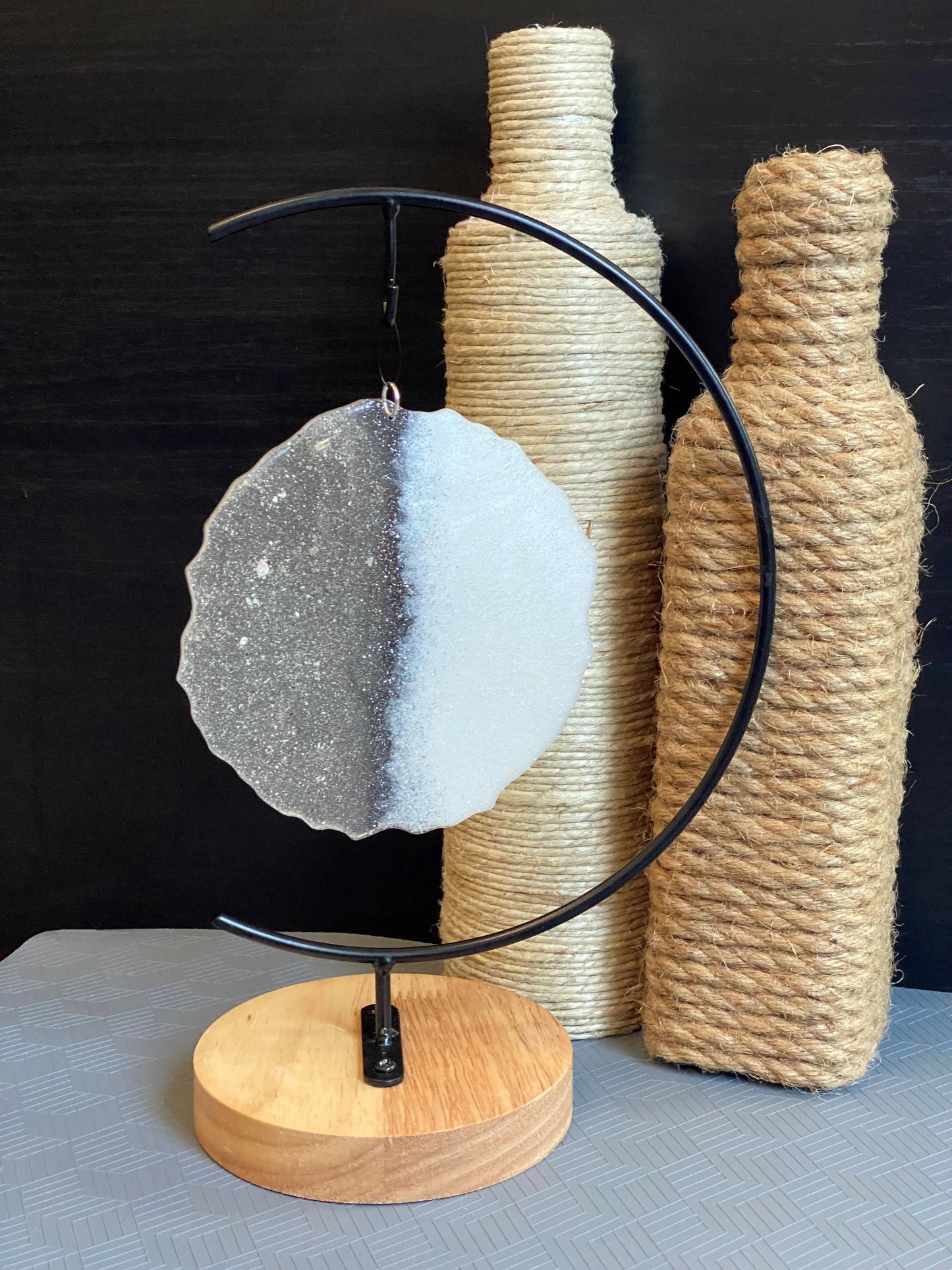 white two-toned ash stand and roped bottles