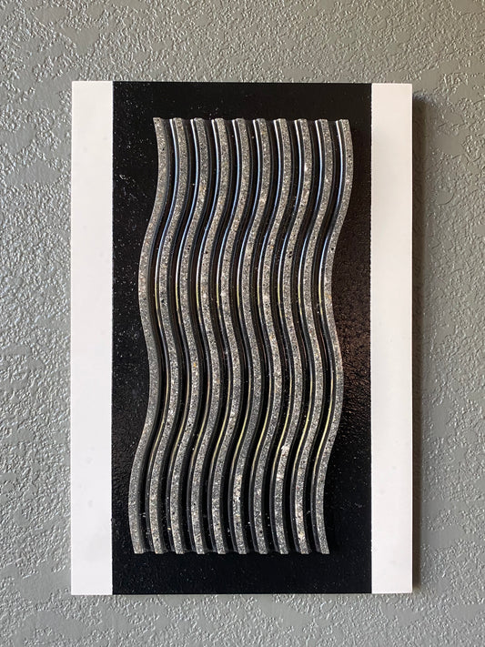 Wavy cremation ash memorial wall art with flowing resin wave pattern on white frame and black stripe