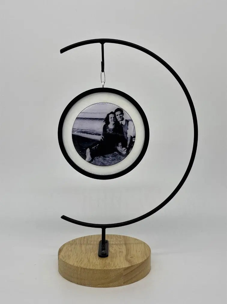 A black and white photo hanging from frame