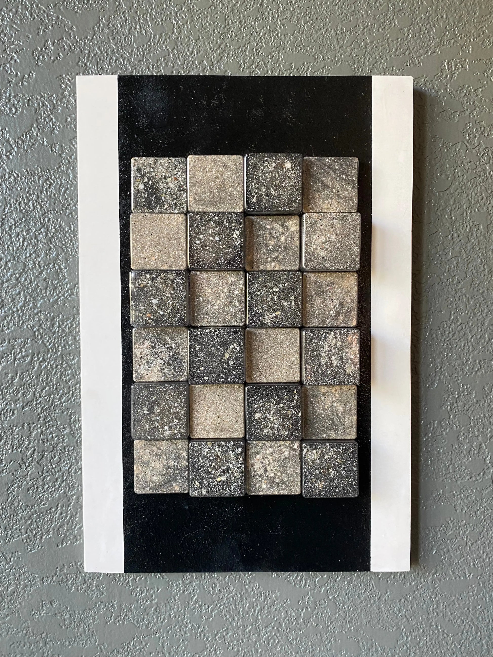 Cubed cremation ash memorial wall art with resin blocks in white frame and black textured stripe
