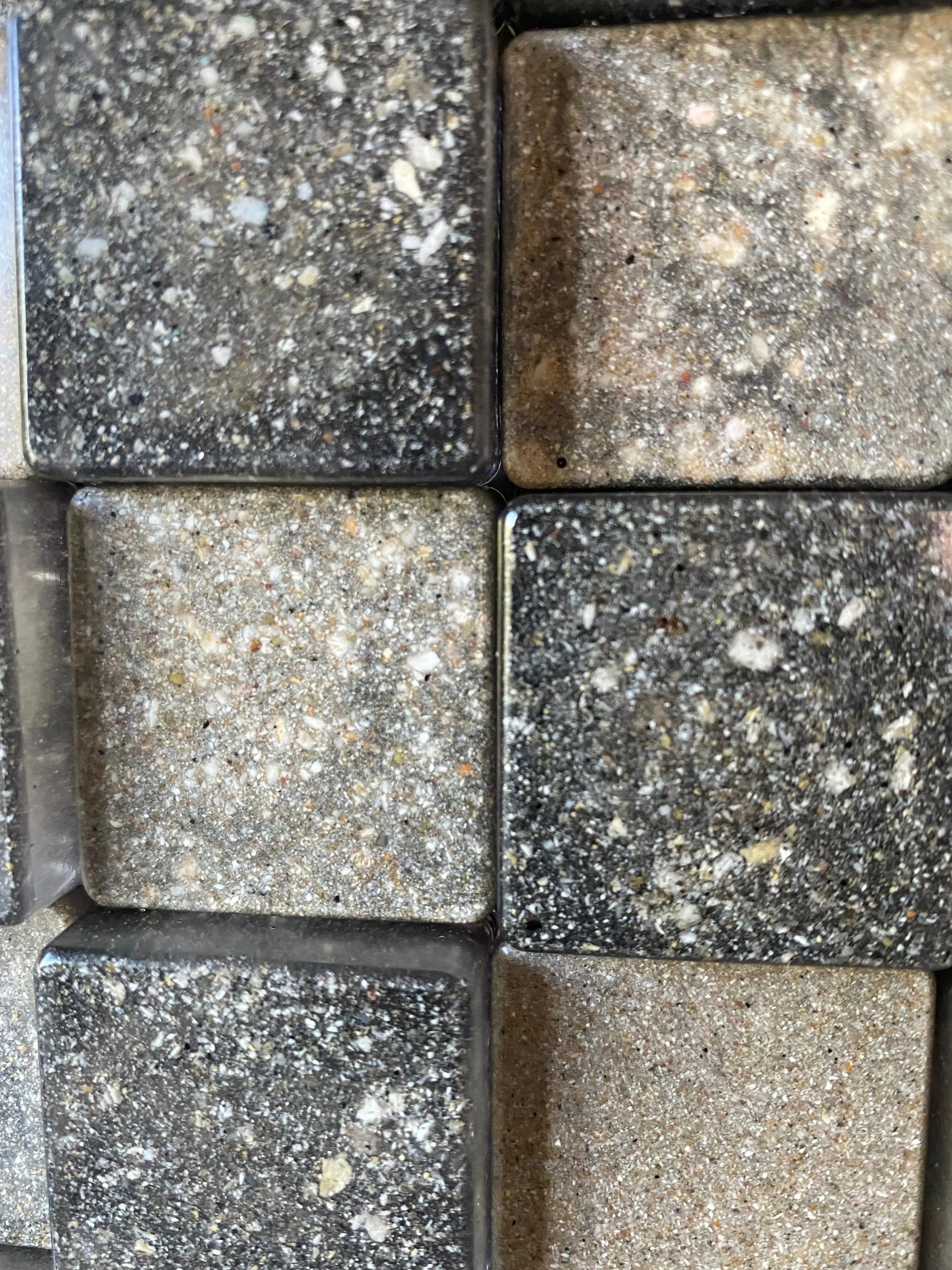 Close up of resin cubes infused with cremation ash, symbolizing strength and balance
