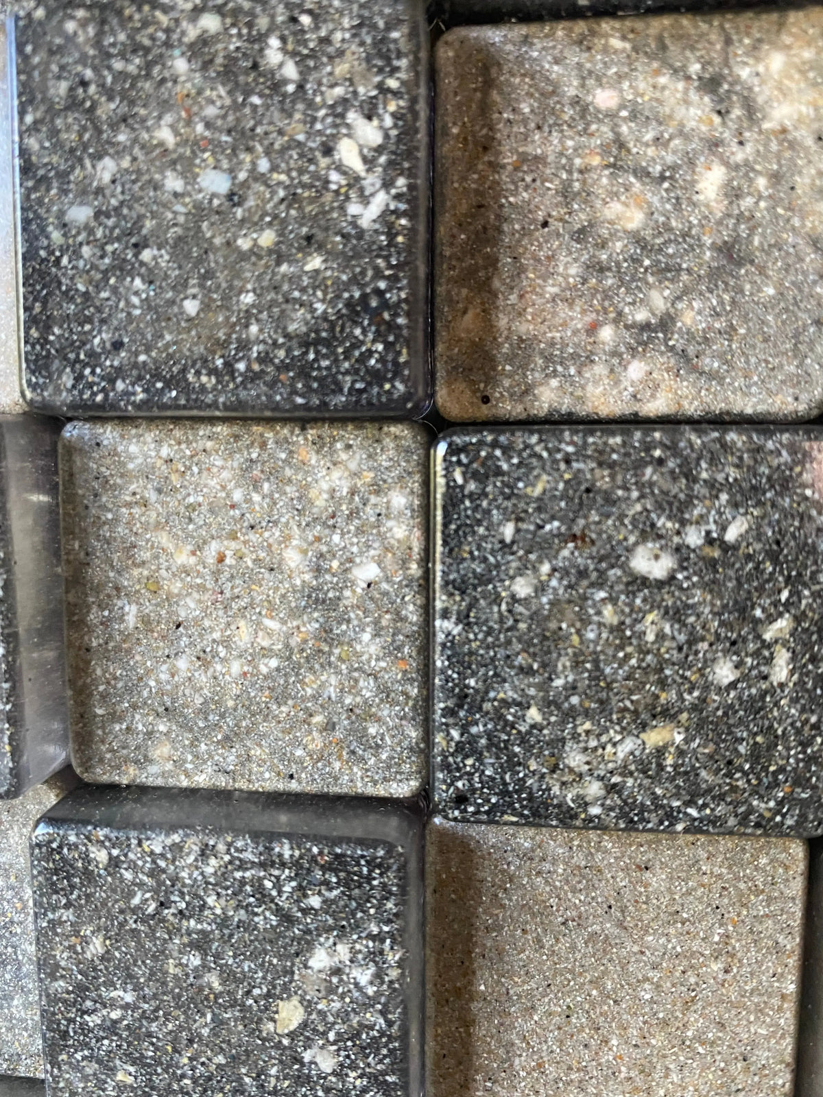 Close up of resin cubes infused with cremation ash, symbolizing strength and balance
