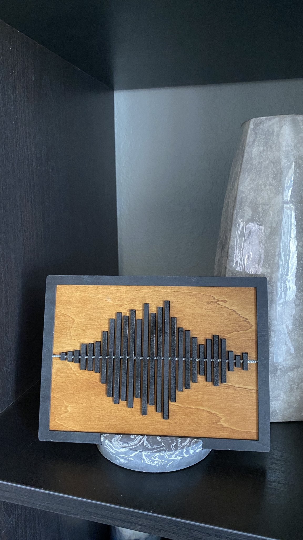 Black framed sound wave with marble stand