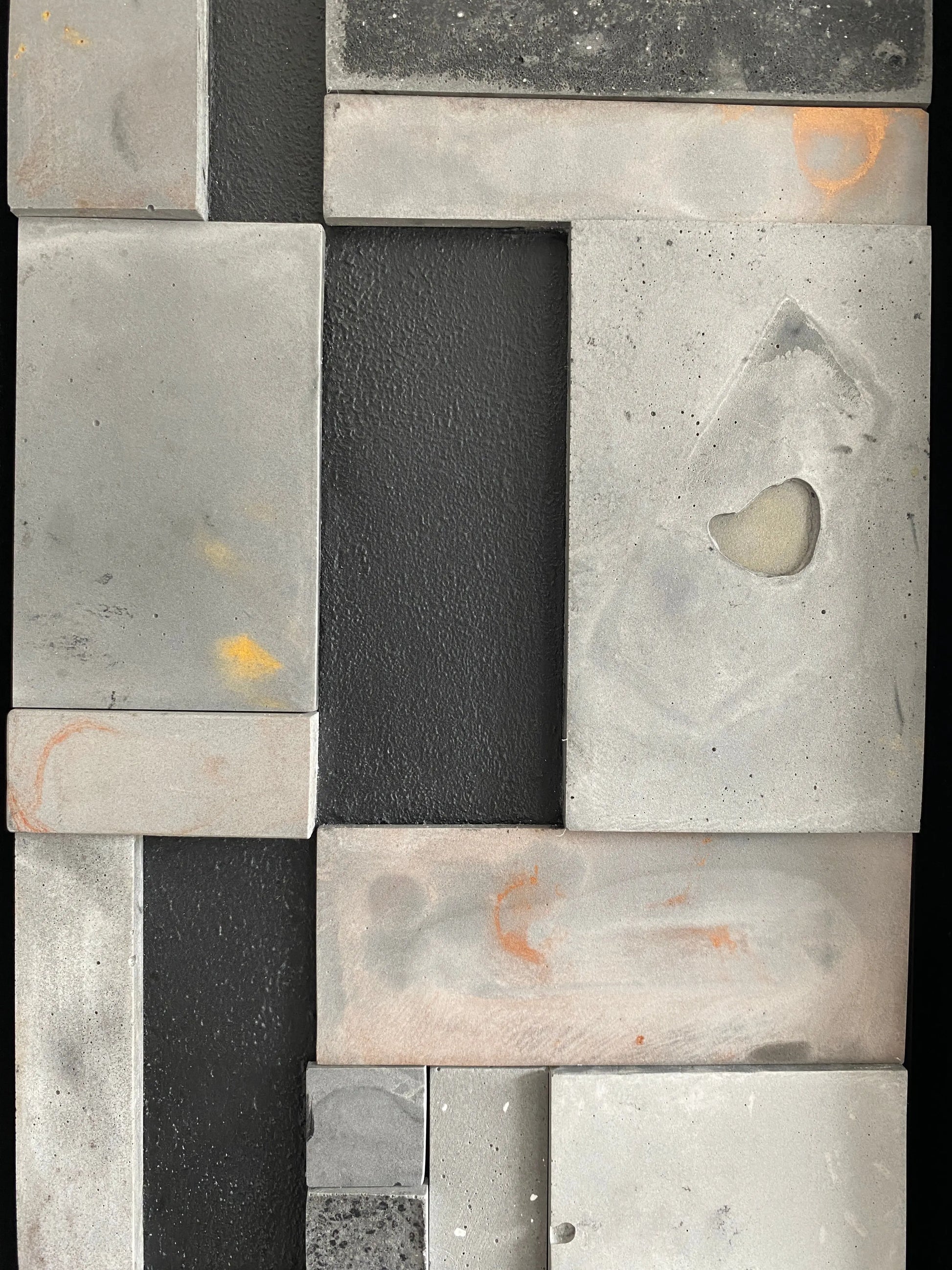 Upclose picture of mosaic wall art triptych with golds and bronze in black floating frame.