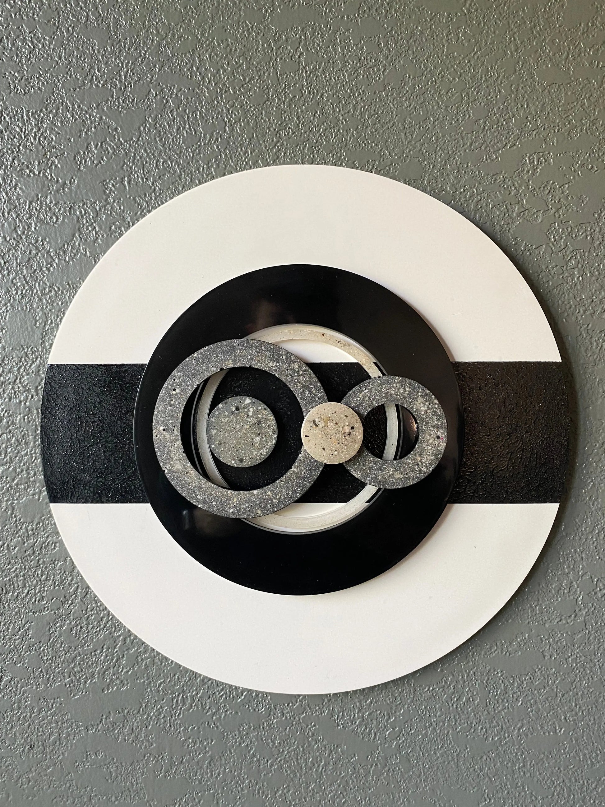 Infinity cremation ash memorial wall art with resin circles on white frame and black textured stripe