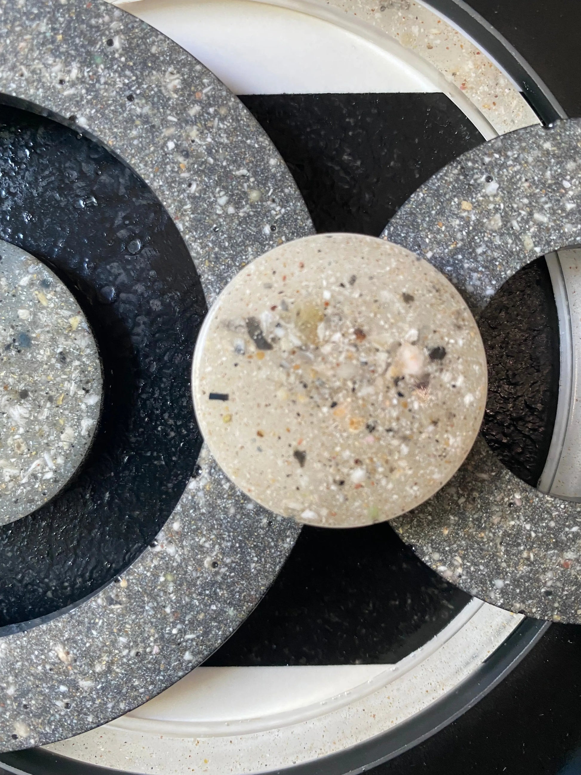 Close-up of resin infinity symbols infused with cremation ash, symbolizing eternal connection
