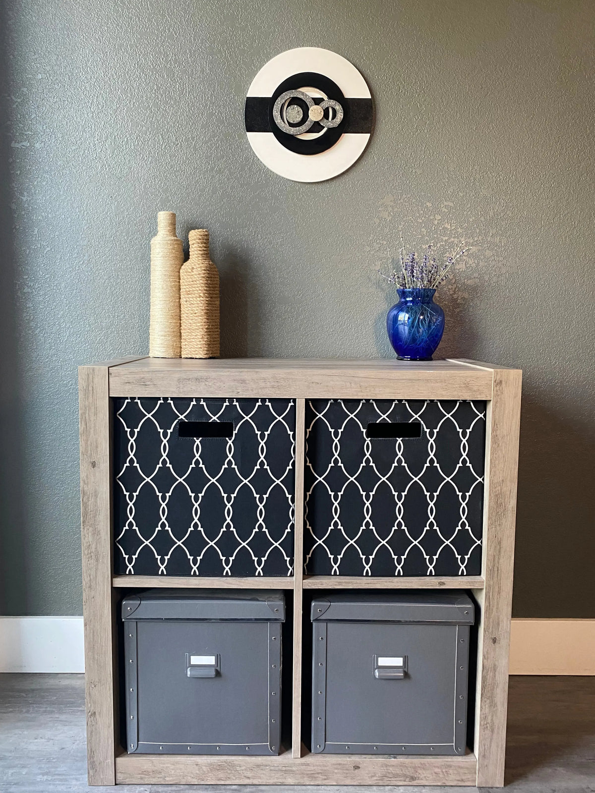Front view of memorial wall art showing layered resin circles, textured black stripe, and handcrafted white frame