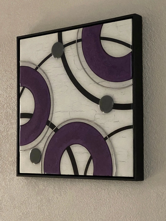 Square mixed‑media artwork with purple resin arcs, black curved lines, and metallic circular elements on a crackled white background in a floating frame.