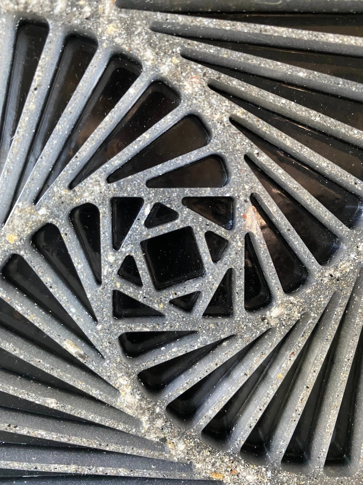 Close-up of resin spiral infused with cremation ash, symbolizing vitality and transformation