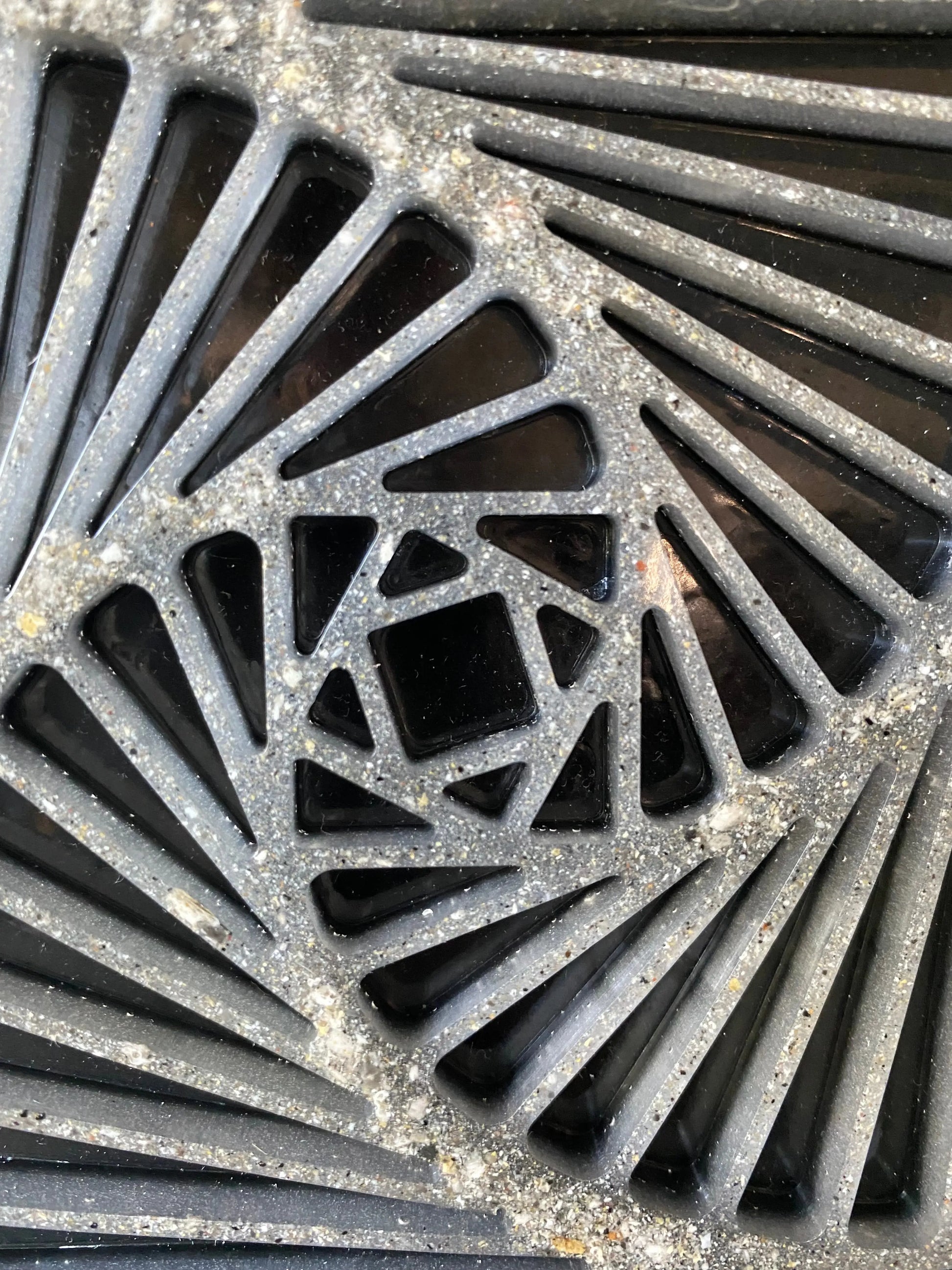 Close-up of resin spiral infused with cremation ash, symbolizing vitality and transformation