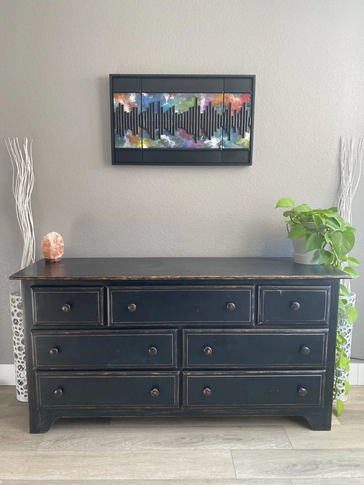 Multicolored mixed‑media artwork featuring a vertical soundwave pattern made from layered acrylic, resined wood, and metal on a handmade cradled panel, framed in a custom floating frame