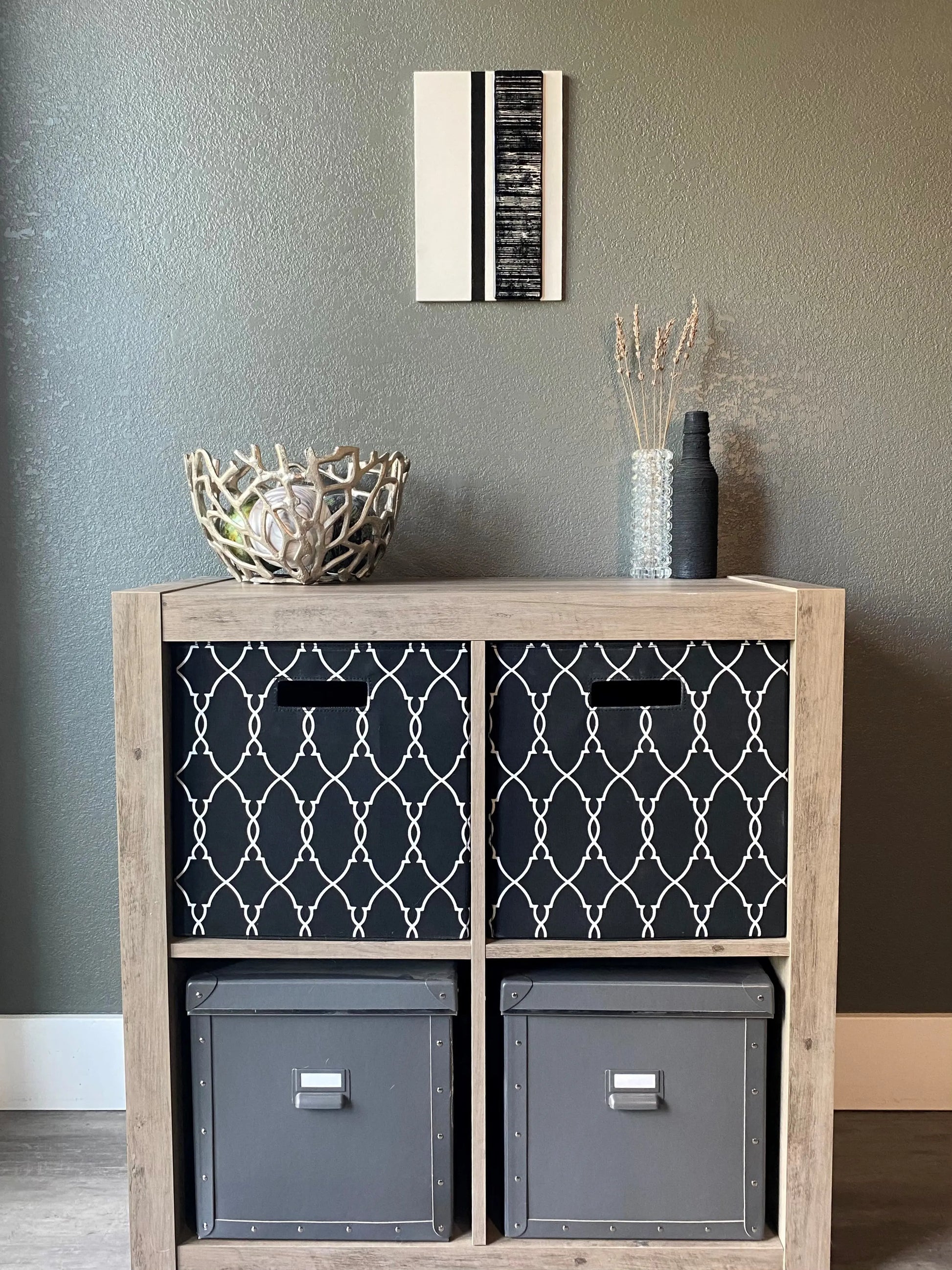 Front view of memorial wall art showing textured black stripe, flowing glass stripes, and handcrafted white frame