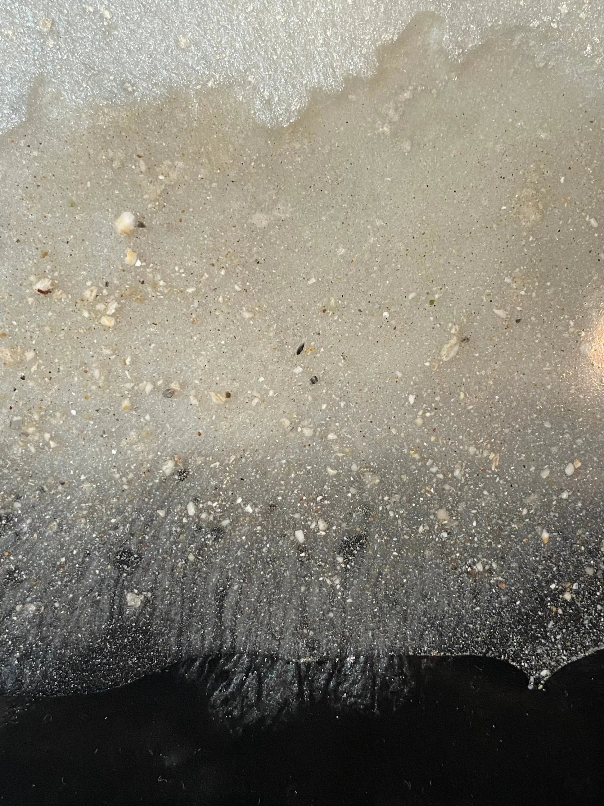 Close-up of flowing tricolor resin infused with cremation ash, symbolizing an unbroken bond