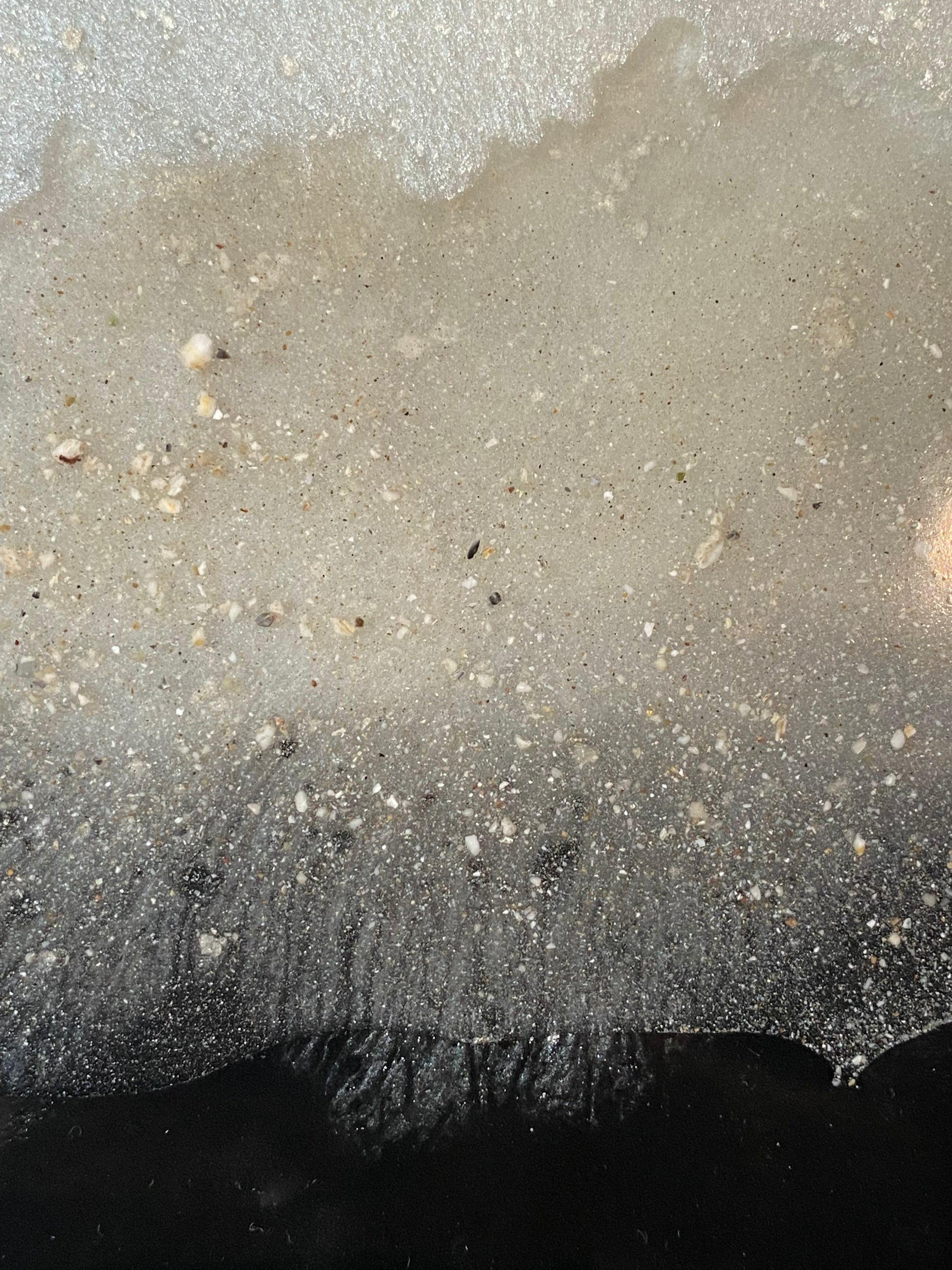 Close-up of flowing tricolor resin infused with cremation ash, symbolizing an unbroken bond