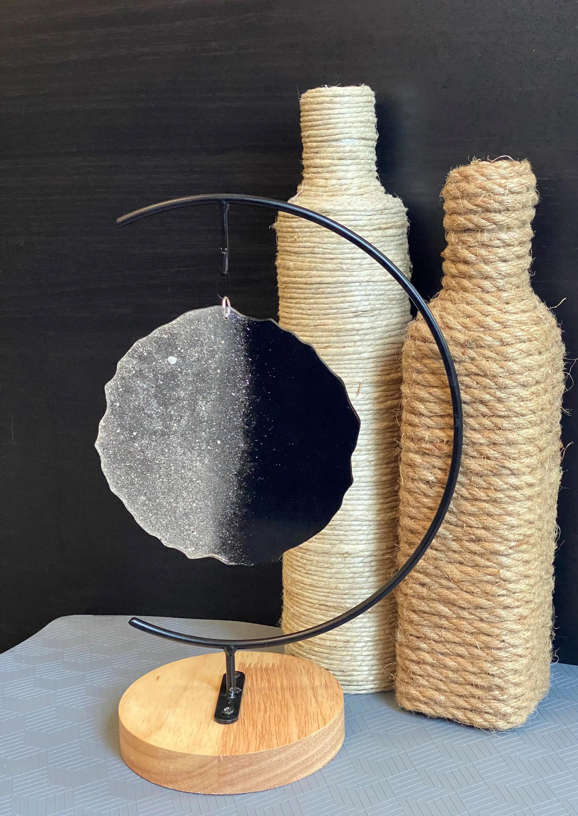 black two-toned ash stand and roped bottles