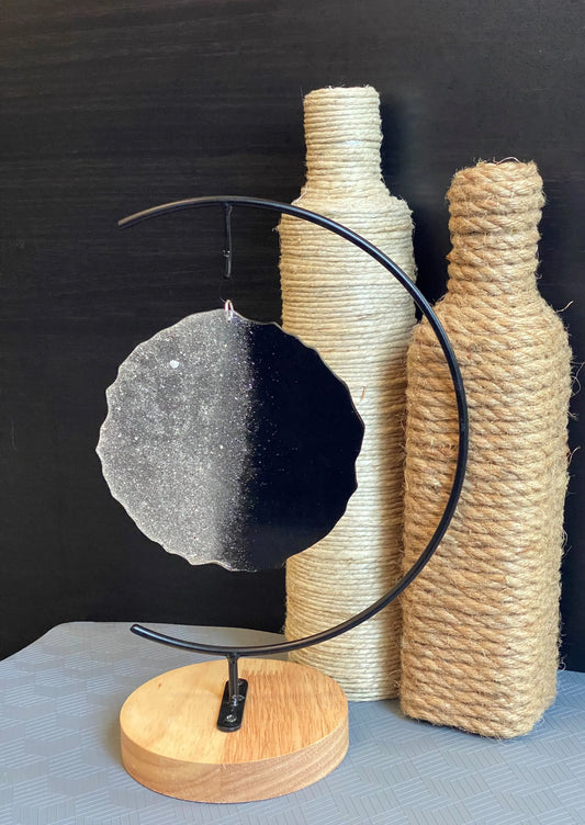 black two-toned ash stand and roped bottles