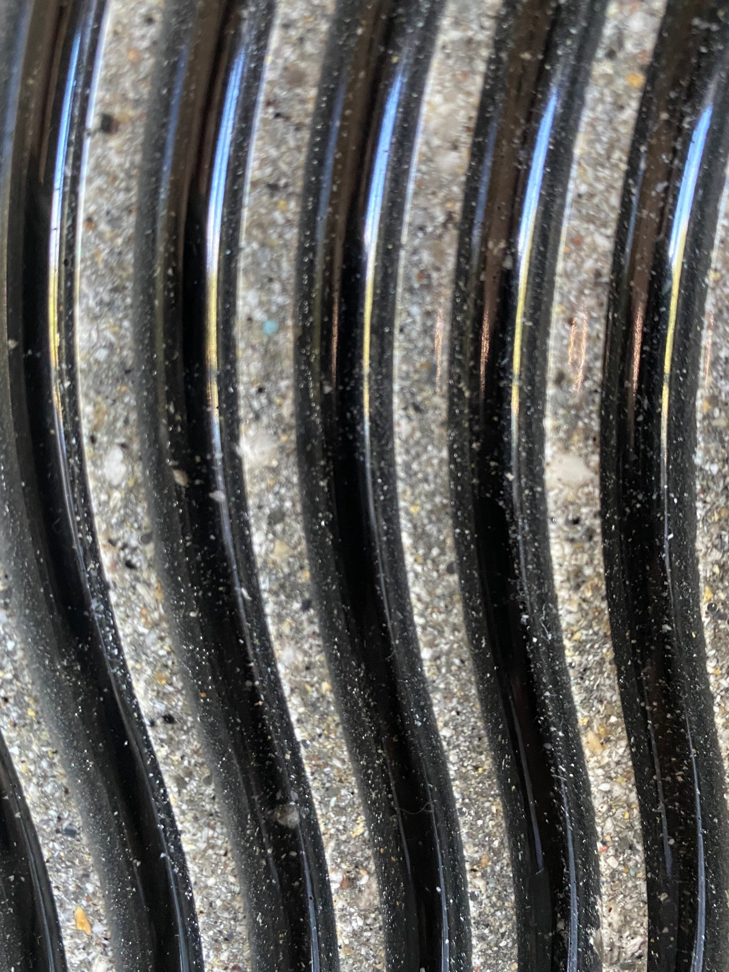 Close-up of flowing resin waves infused with cremation ash, symbolizing a poetic journey and eternal love