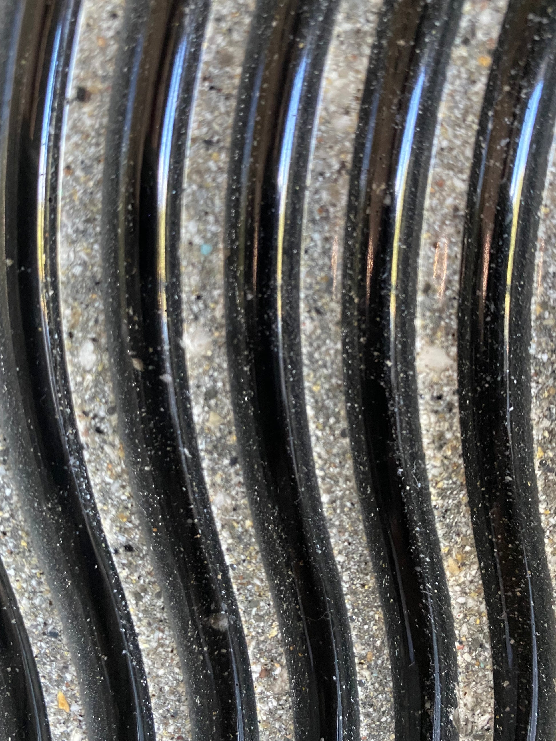 Close-up of flowing resin waves infused with cremation ash, symbolizing a poetic journey and eternal love
