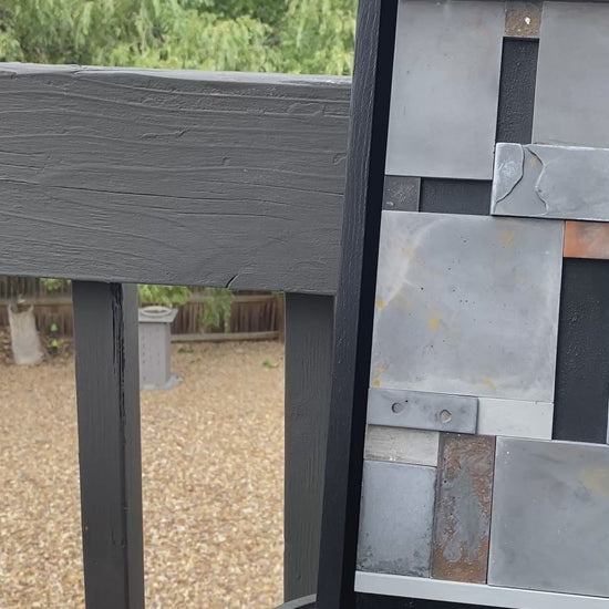 Mosiac Wall Art outside showing the glimmers and shimmers of color on table.