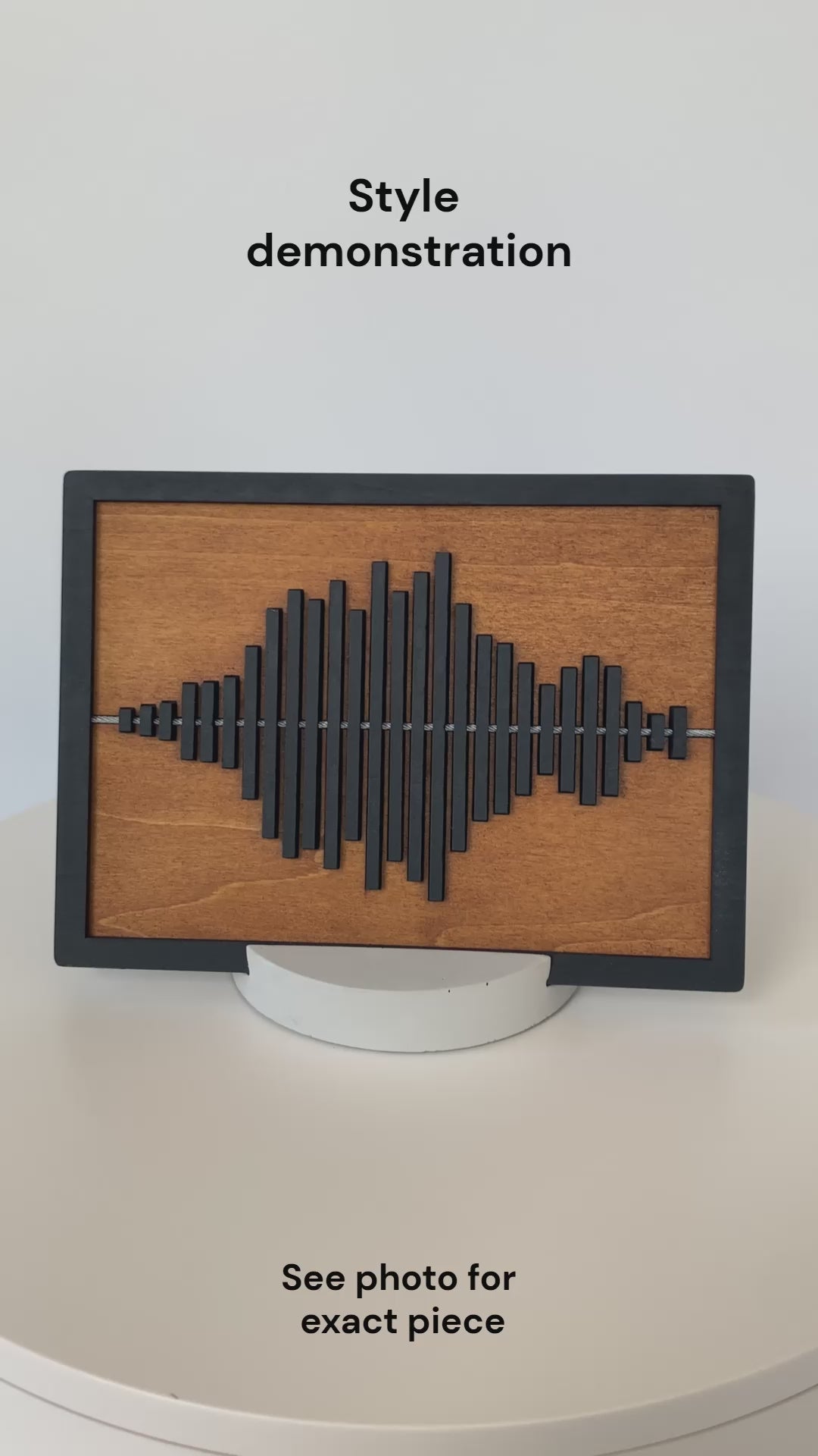 Rotating view of the Always With You Sound Wave Wood Display Piece with cement stand, demonstrating the design and shape.
