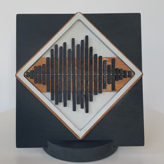 Rotating view of the Always With You Sound Wave Diamond Display Piece in plain cement, demonstrating the design and shape.